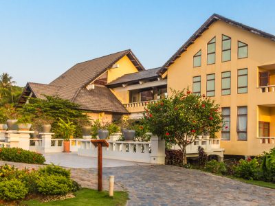 Vietnamese hotel building with garden in the evening